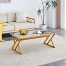 A coffee table is made of rock slab material, with a natural and smooth marble pattern on the surface, which complements the modern design of the golden metal legs and adds a touch of fashion.47*23.6