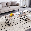 A coffee table is made of rock slab material, with a natural and smooth marble pattern on the surface, which complements the modern design of the black metal legs and adds a touch of fashion.47*23.6